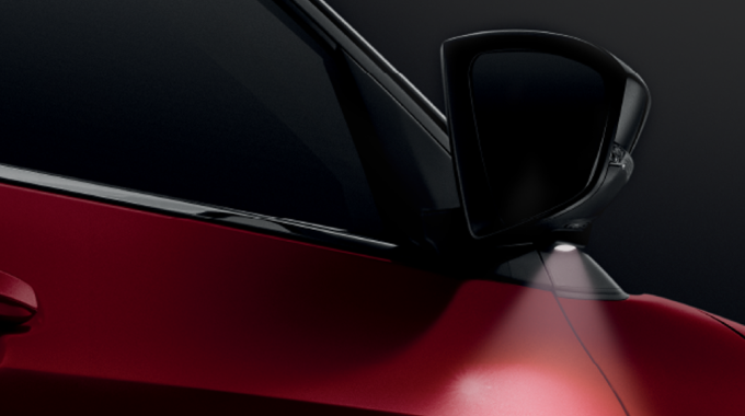 Retractable side mirror with welcome lamp